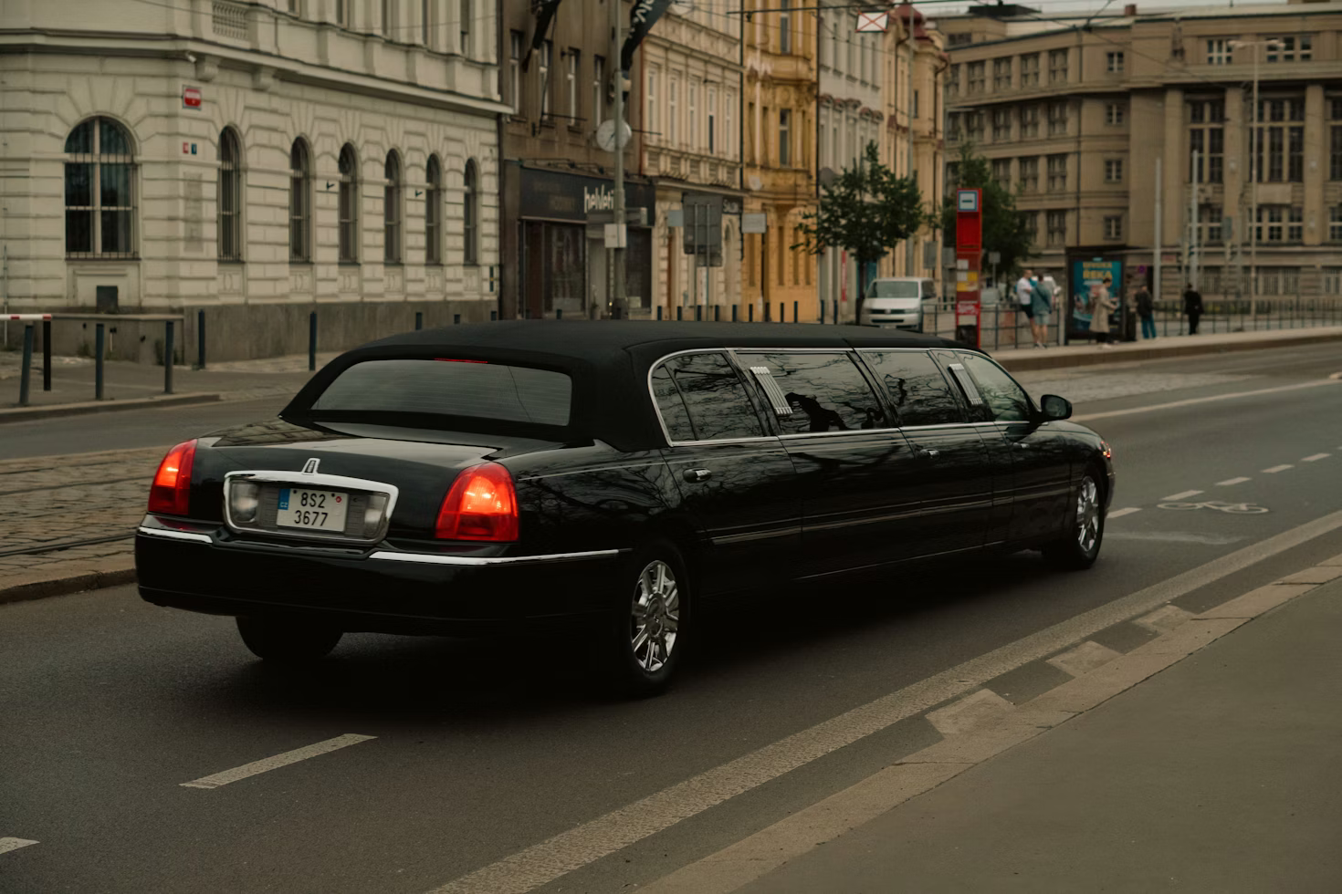 Cars Segments - Chauffeur cabs luxury black limousine providing professional chauffeur service in a city street