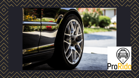 Closeup of luxury car alloy wheels, high-end chrome rims, premium wheel design for upscale cars