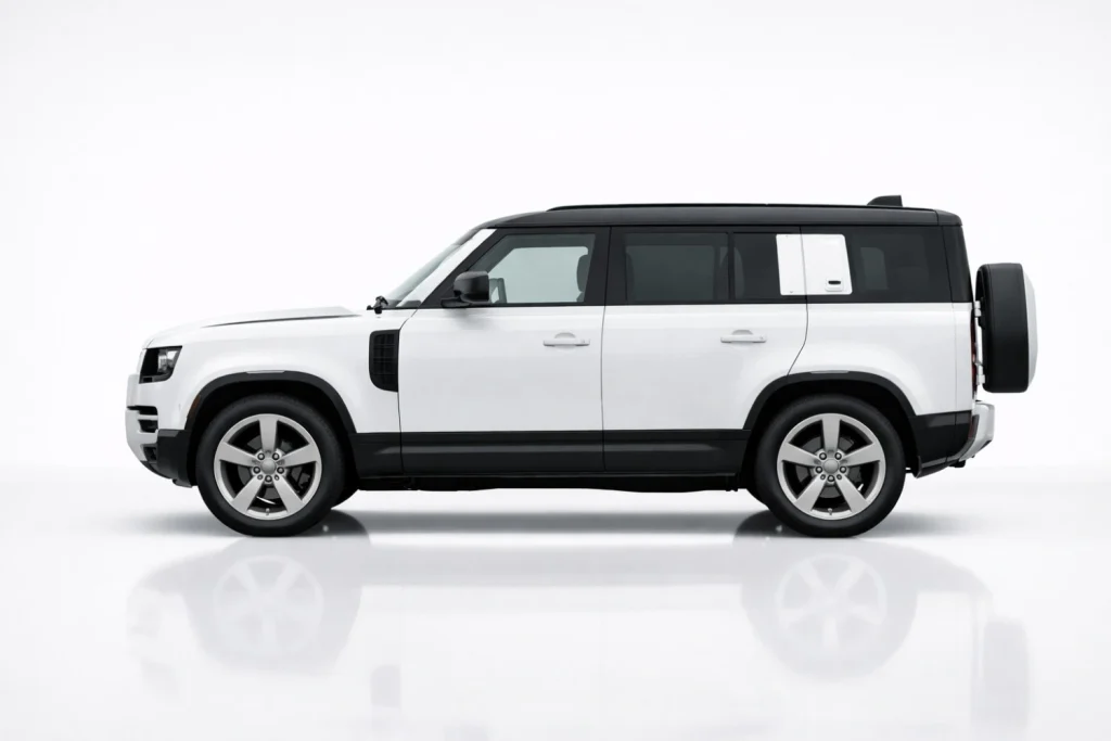 Land Rover Defender side profile displaying boxy silhouette and rugged SUV proportions