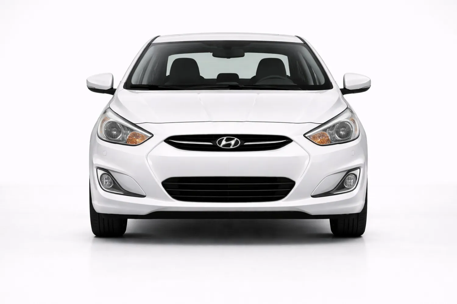 Honda City front view showing chrome grille, LED headlights, and premium sedan stance