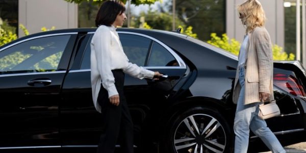 female passenger with luxury car banner